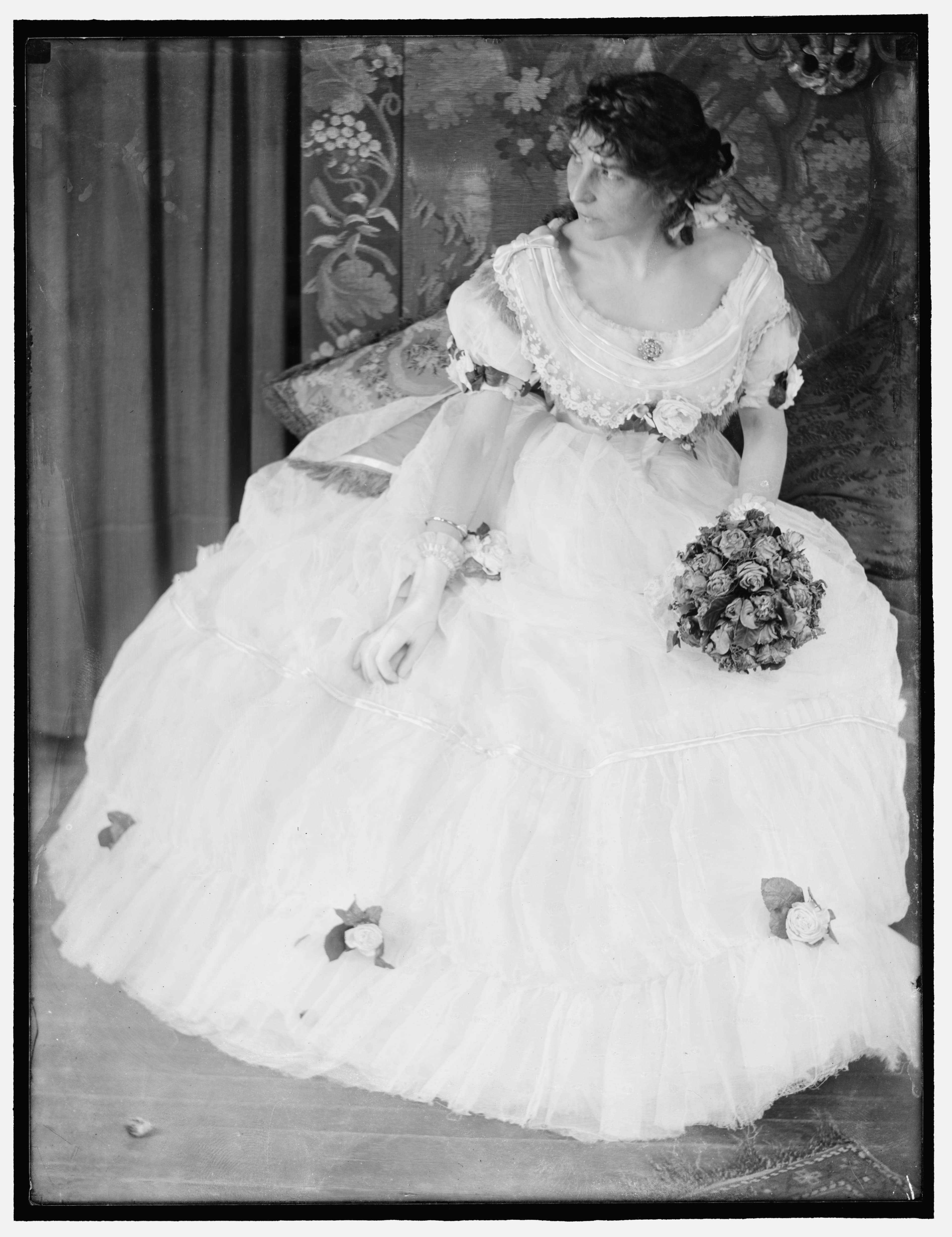 A figure in a white dress, a room, early light