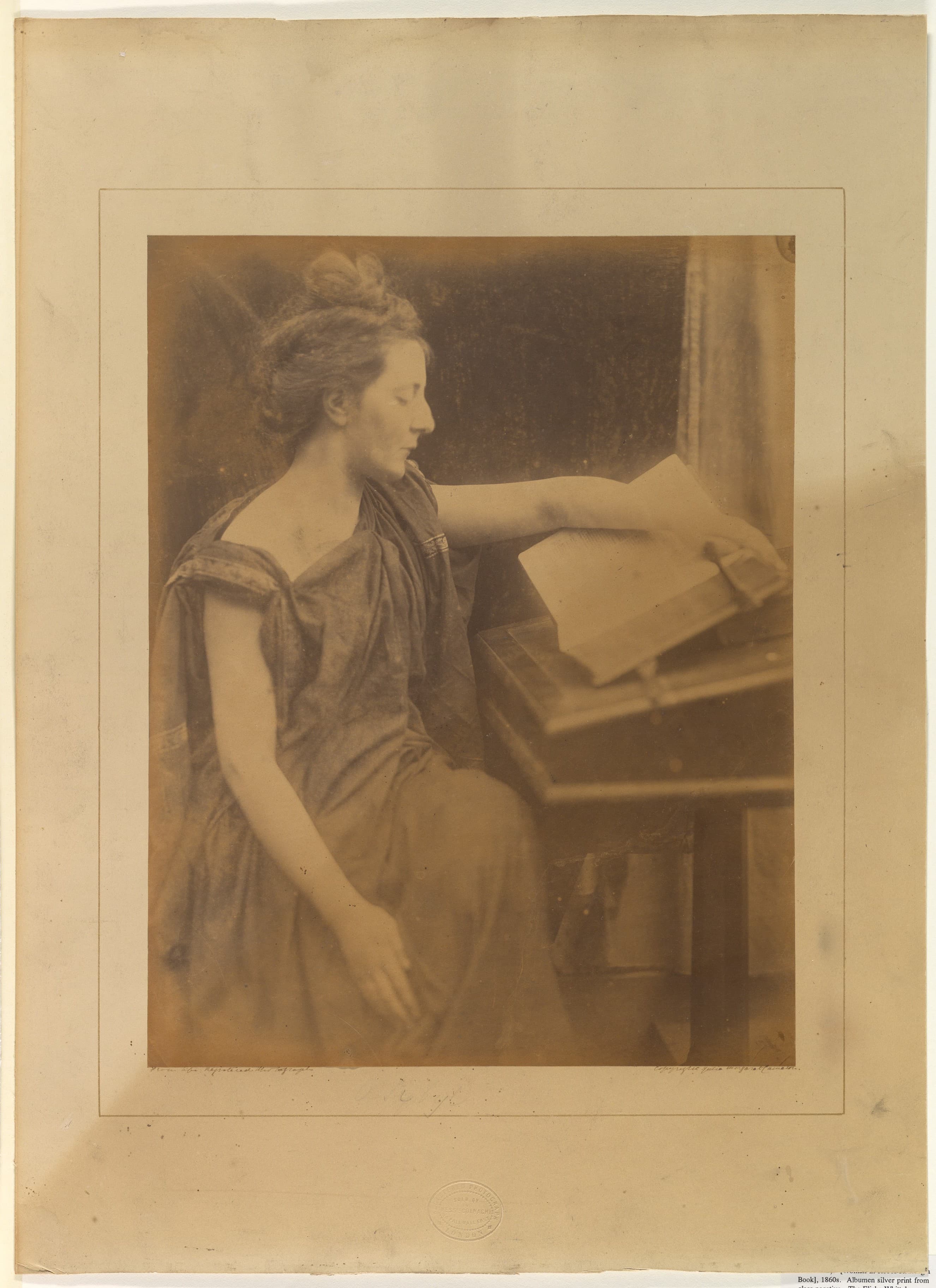 A woman in robes, reading
